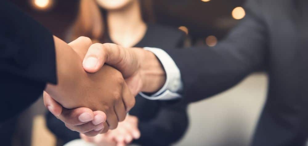 Shaking Hands After Closing a deal that can access the Small Business CGT Concessions