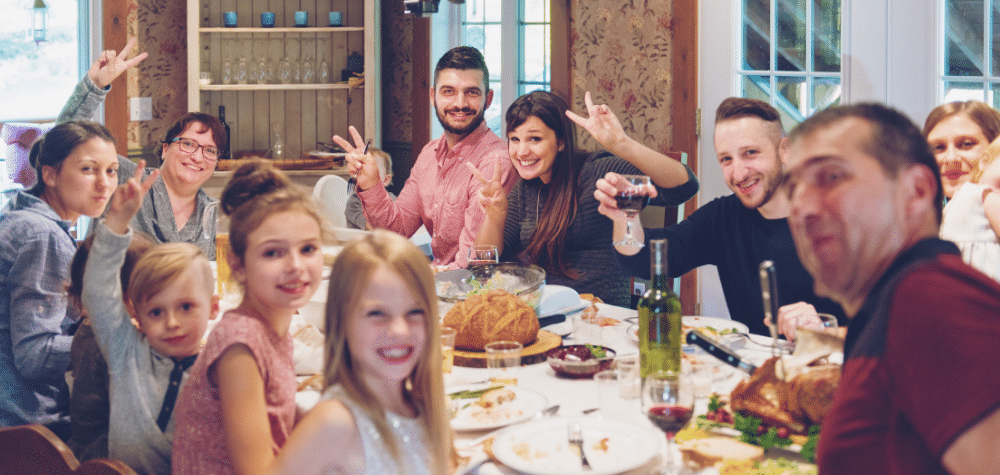 A group of people enjoying a meal who may receive holiday pay from their work